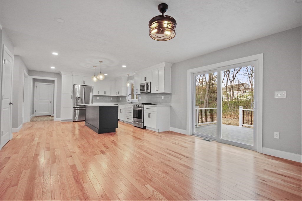 529 Chadwick Road Haverhill, MA 01835 - Photo 12 of 38 a view of a kitchen with a stove cabinets and wooden floor