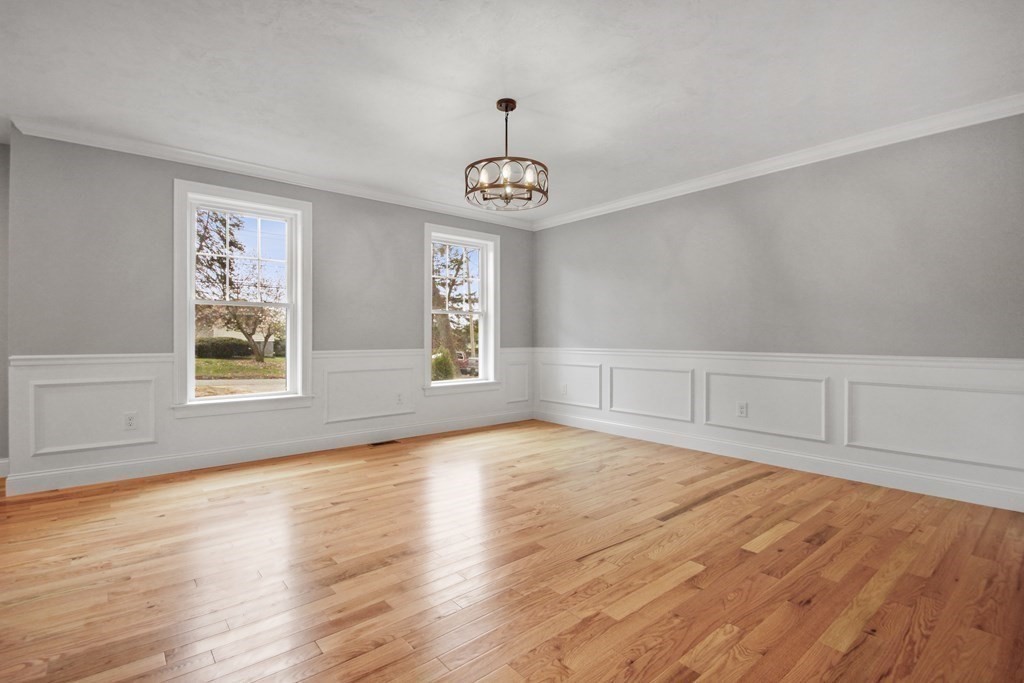 529 Chadwick Road Haverhill, MA 01835 - Photo 16 of 38 a view of an empty room with wooden floor and a window