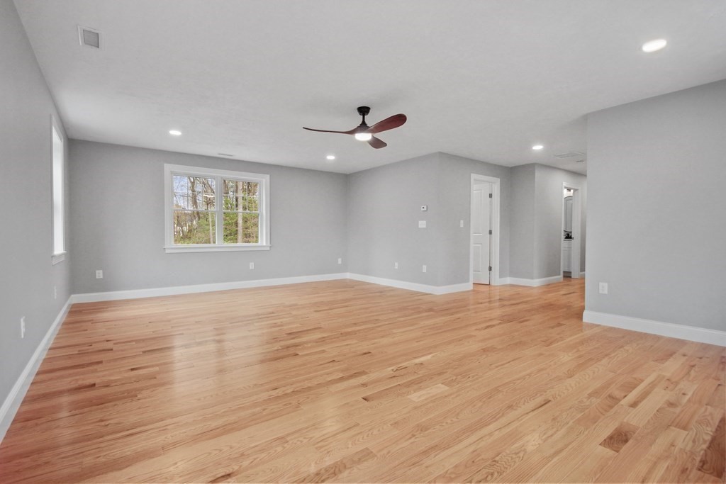 529 Chadwick Road Haverhill, MA 01835 - Photo 24 of 38 a view of an empty room with a window and wooden floor