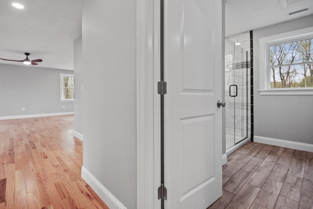 529 Chadwick Road Haverhill, MA 01835 - Photo 25 of 38 a view of a hallway with wooden floor and closet area