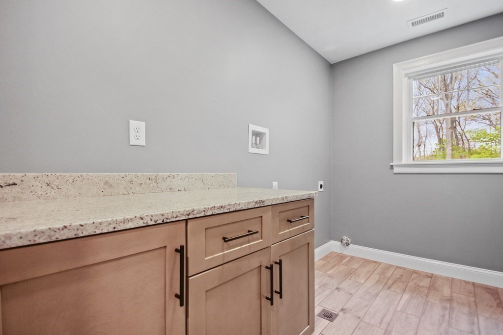 529 Chadwick Road Haverhill, MA 01835 - Photo 34 of 38 a room with granite countertop cabinets appliances and a window