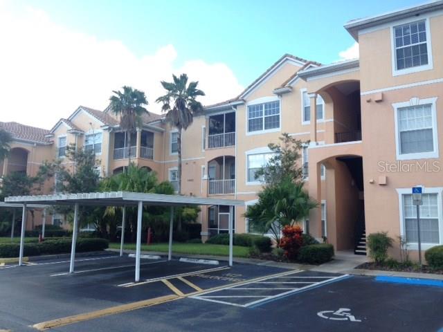 13512 Turtle Marsh Loop, Unit 725 Orlando, FL 32837 - Photo 1 of 1 a view of outdoor space yard and front view of a building
