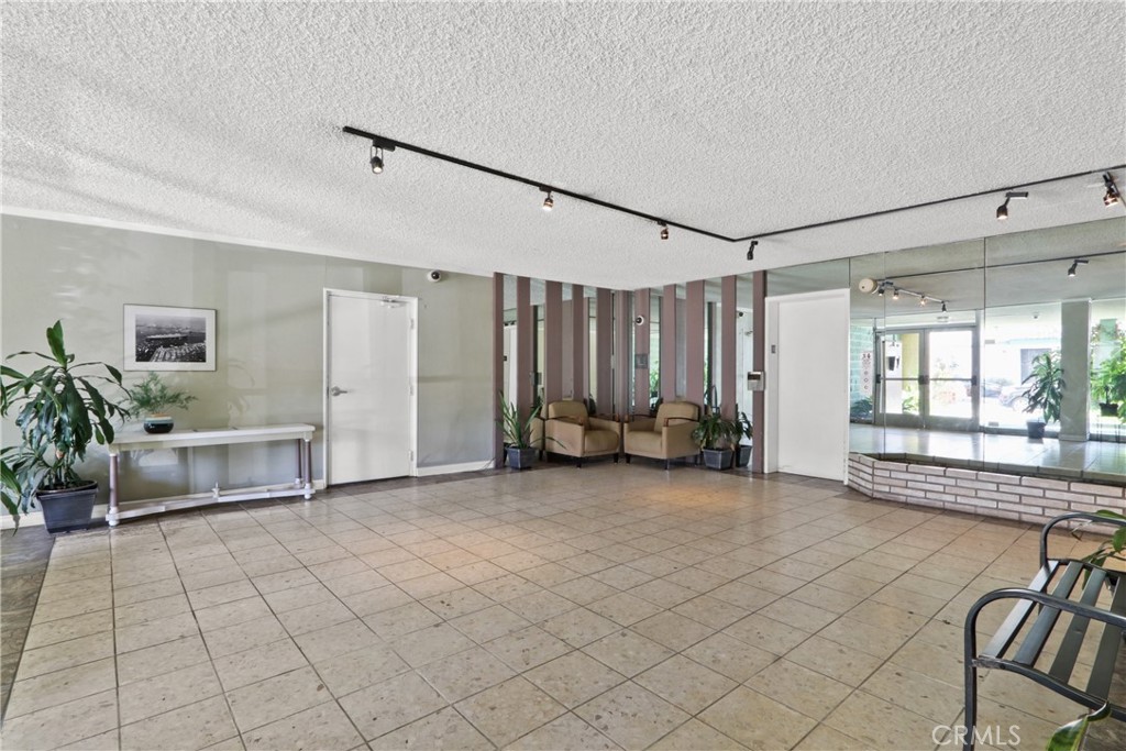 1187 East 3rd Street, Unit 215 Long Beach, CA 90802 - Photo 12 of 15 a view of a livingroom with furniture and windows