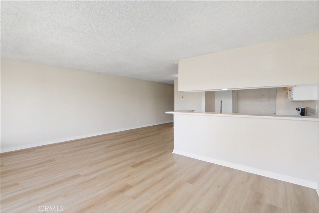 1187 East 3rd Street, Unit 215 Long Beach, CA 90802 - Photo 5 of 15 a view of empty room with wooden floor