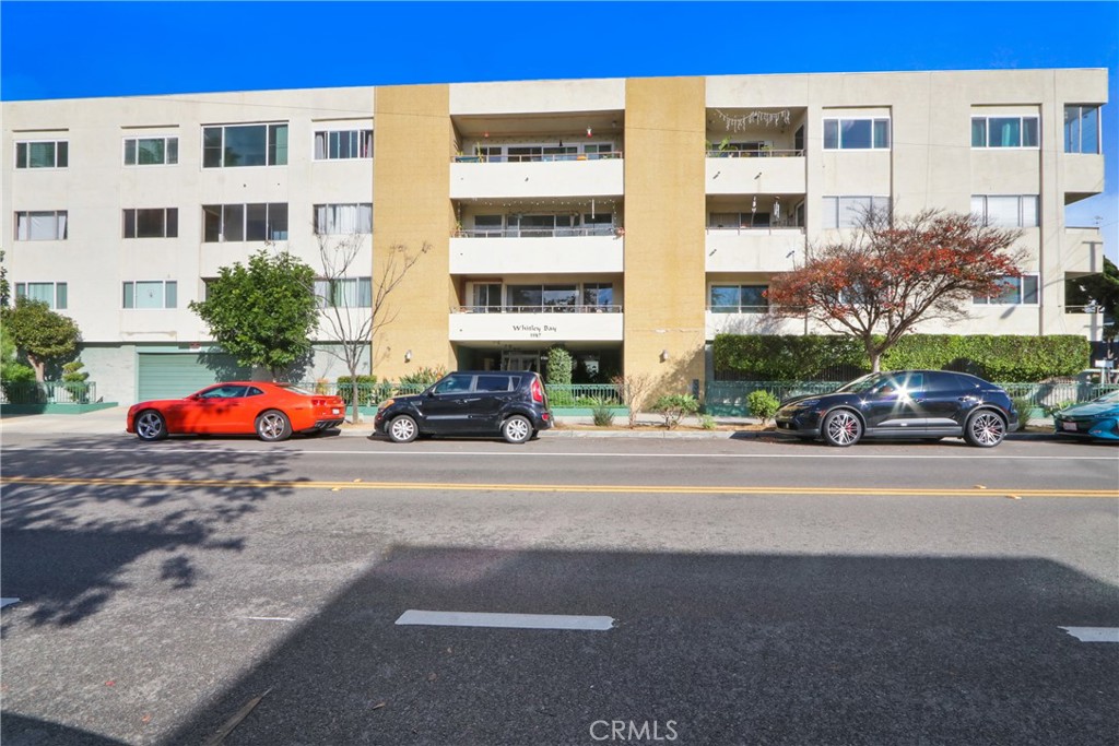 1187 East 3rd Street, Unit 215 Long Beach, CA 90802 - Photo 10 of 15 a cars parked in front of a building