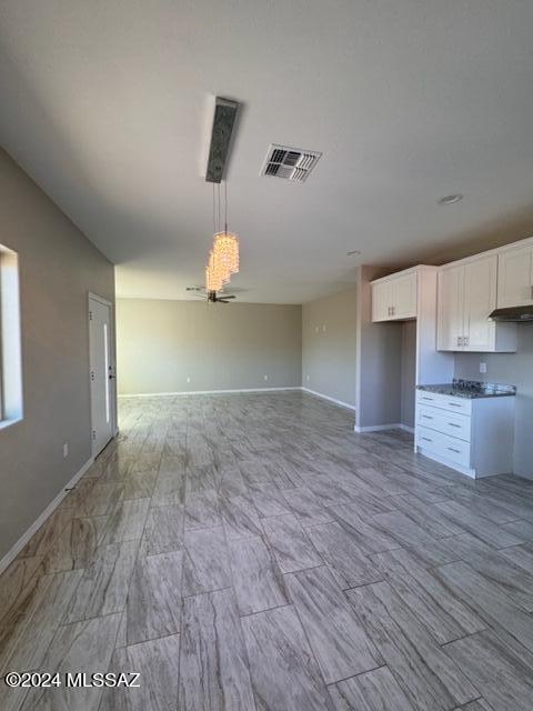 154 Calle Victoria Rio Rico, AZ 85648 - Photo 13 of 27 a view of a kitchen with a sink and wooden floor