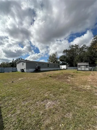 a view of outdoor space with deck and yard