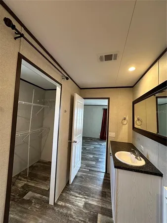 a bathroom with a sink a mirror and a shower