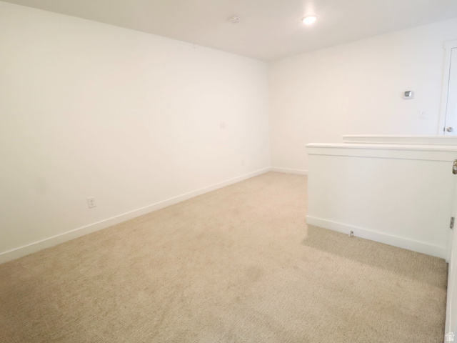 8240 Cascade Vw Way Magna, UT 84044 - Photo 5 of 18 Unfurnished room with light colored carpet and baseboards