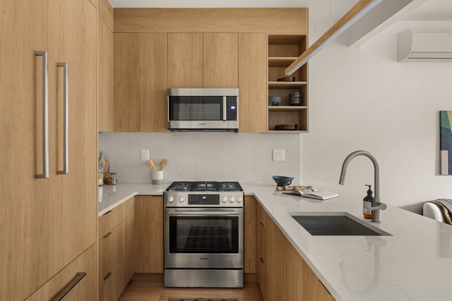1230 Putnam Avenue, Unit 3 Brooklyn, NY 11221 - Photo 4 of 11 a kitchen with stainless steel appliances granite countertop a sink stove and microwave