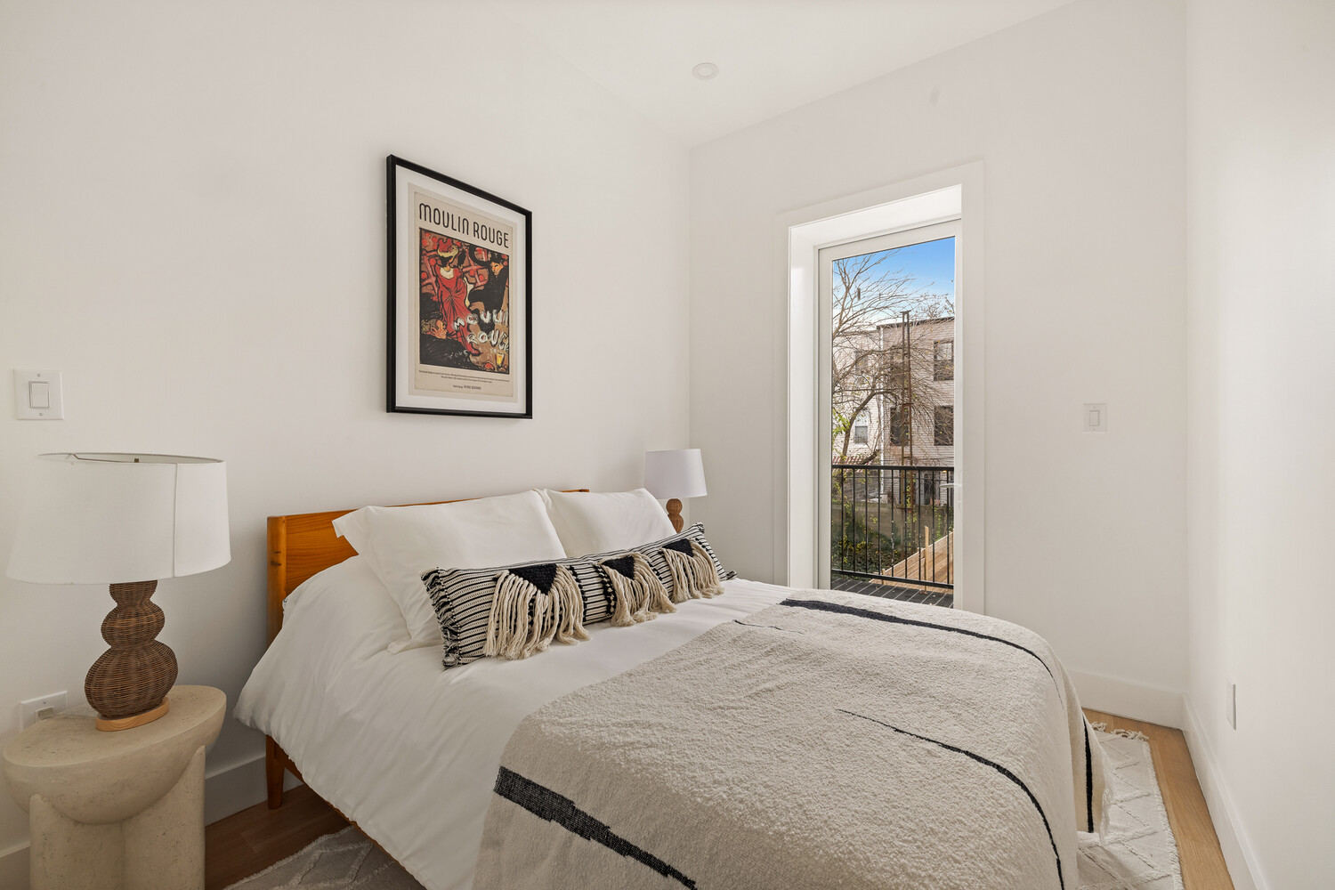 1230 Putnam Avenue, Unit 3 Brooklyn, NY 11221 - Photo 8 of 11 a bedroom with a bed and a window