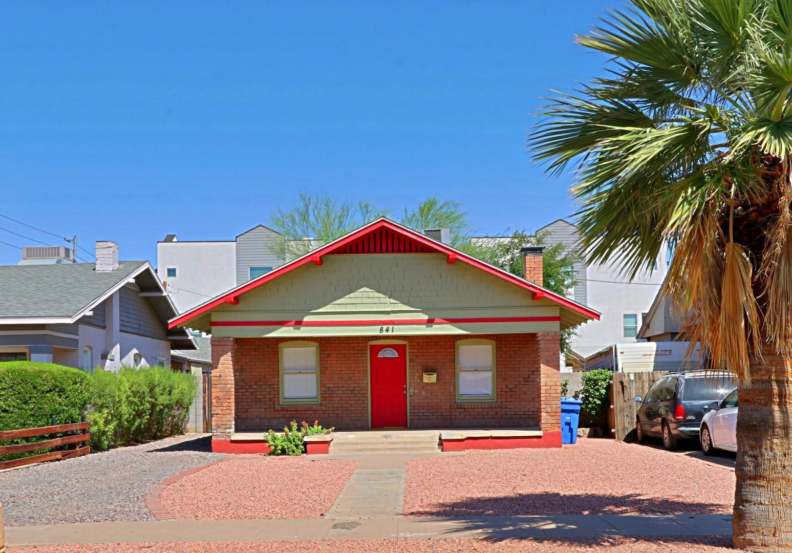 841 North 9th Avenue Phoenix, AZ 85007 - Photo 1 of 21 a front view of a house with a yard and garage