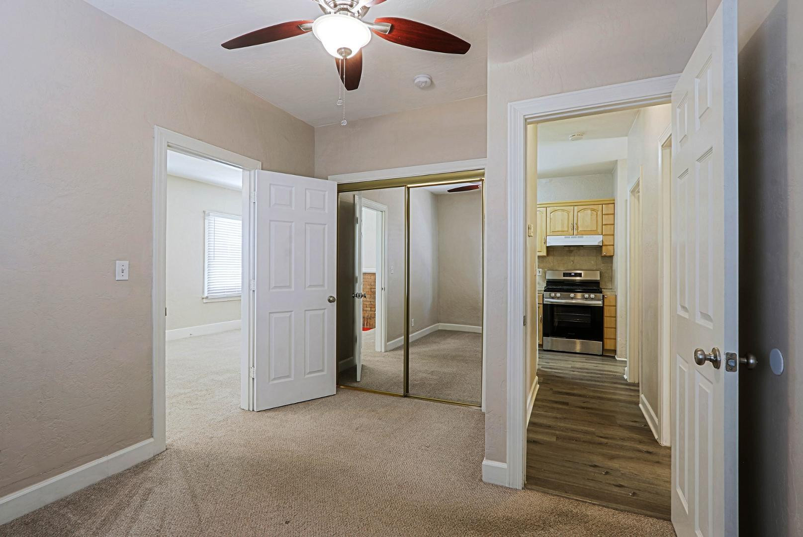 841 North 9th Avenue Phoenix, AZ 85007 - Photo 11 of 21 an empty room with closet and a hallway