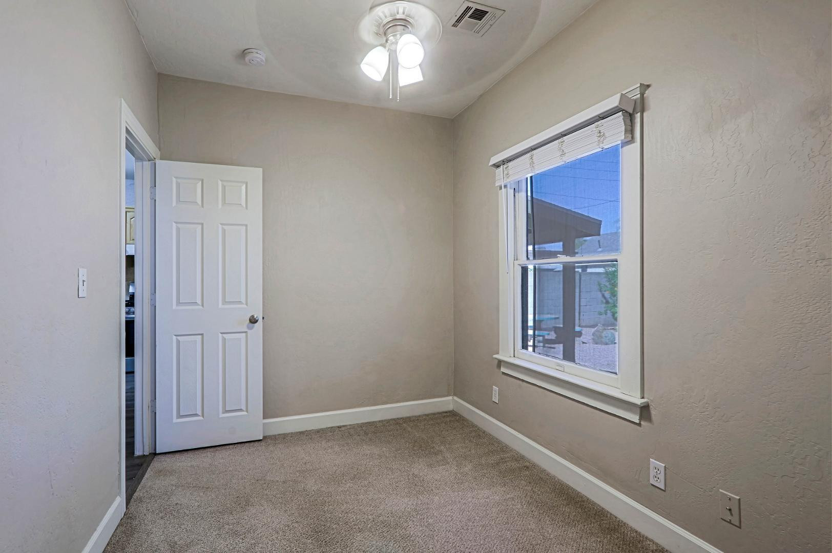 841 North 9th Avenue Phoenix, AZ 85007 - Photo 12 of 21 an empty room with windows and closet