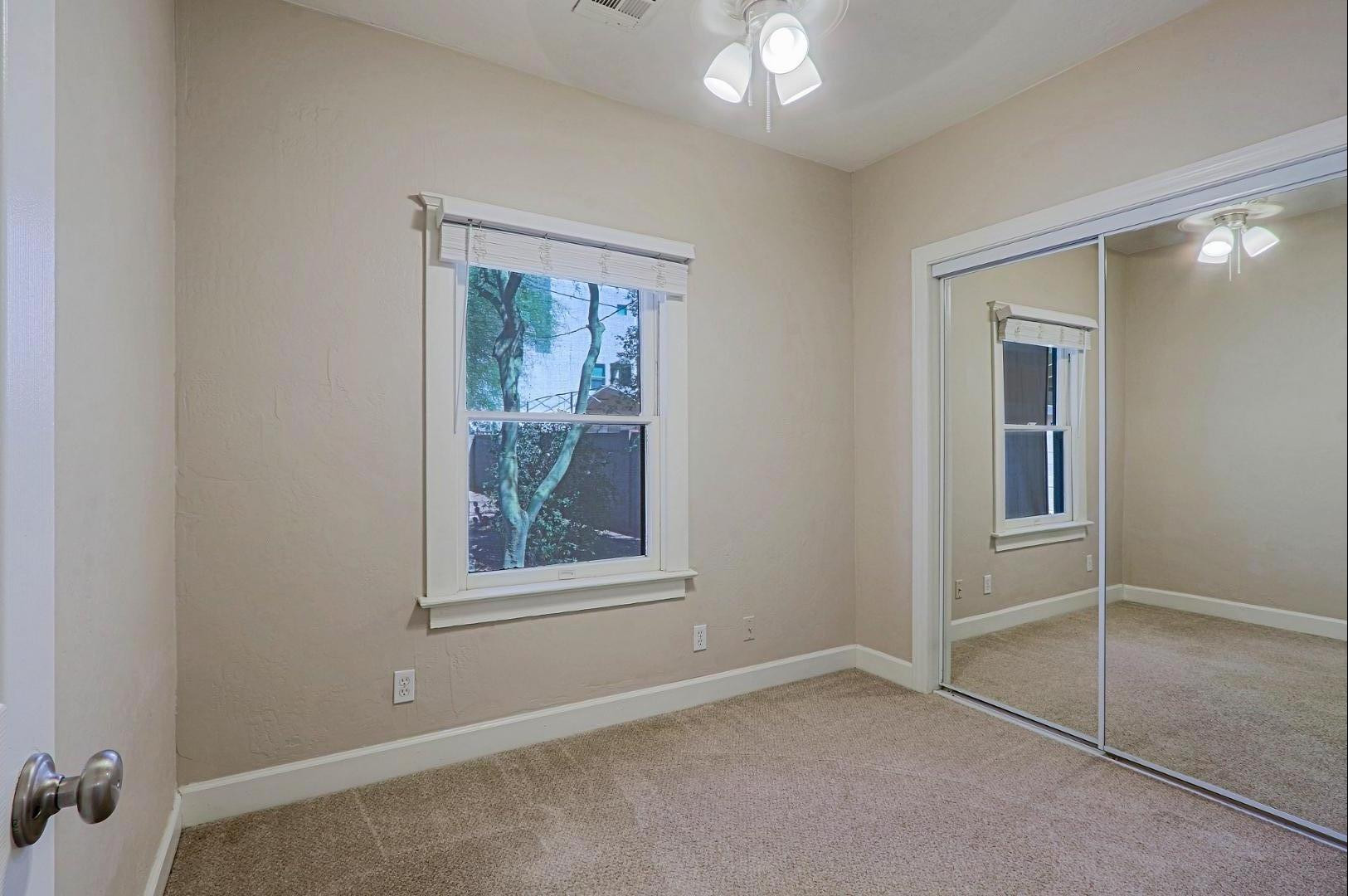 841 North 9th Avenue Phoenix, AZ 85007 - Photo 13 of 21 an empty room with windows and closet