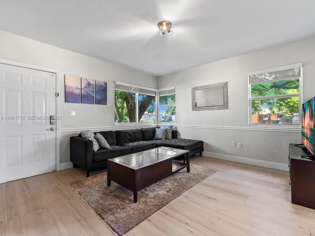 a living room with furniture and a window