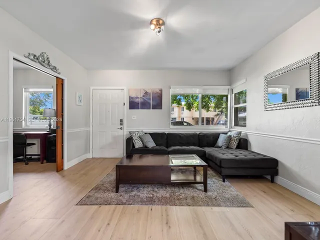 a living room with furniture and a window