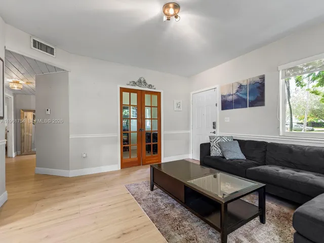 a living room with furniture and a window