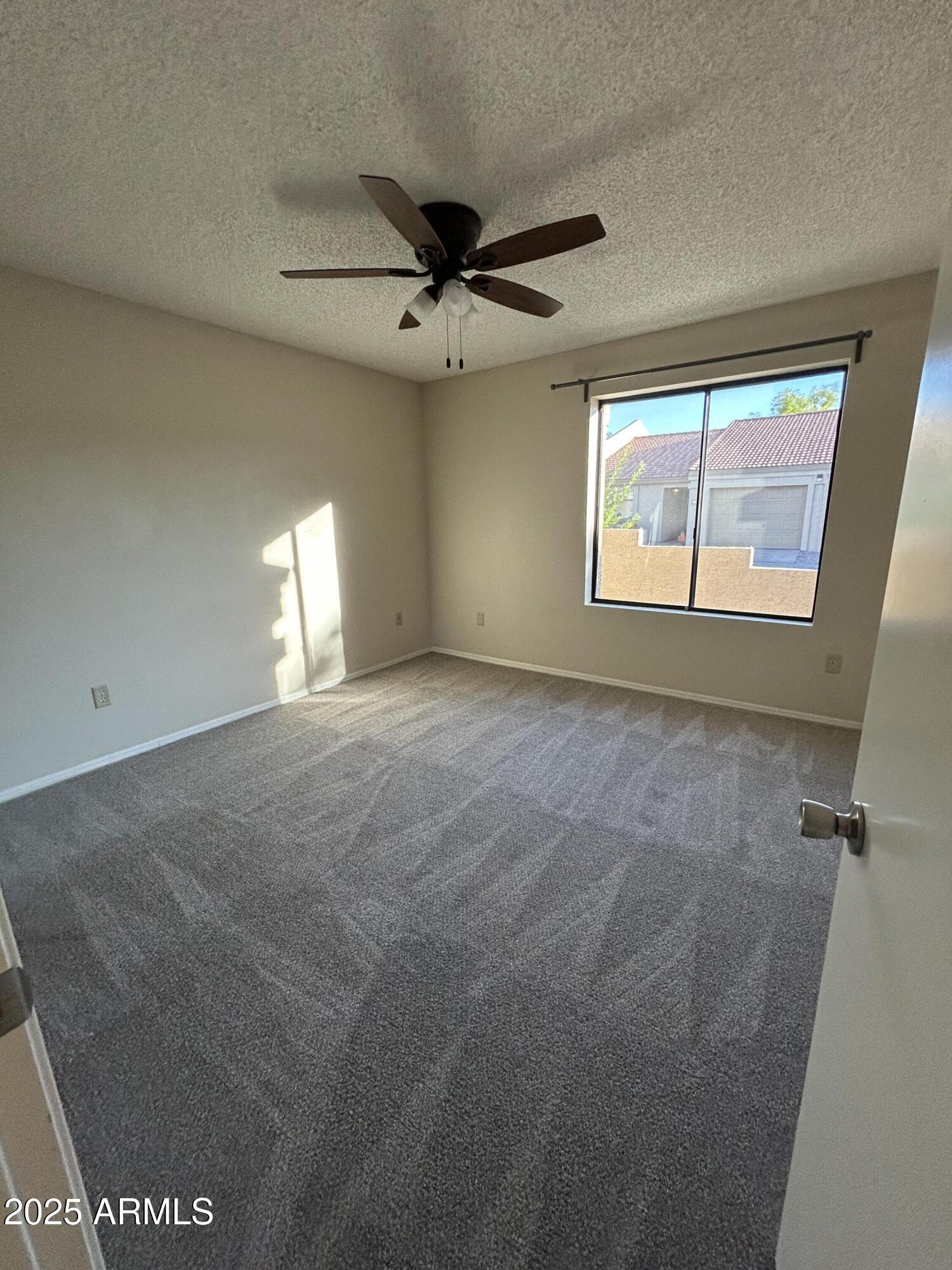 1021 South Greenfield Road, Unit 1198 Mesa, AZ 85206 - Photo 14 of 29 a view of an empty room with a window