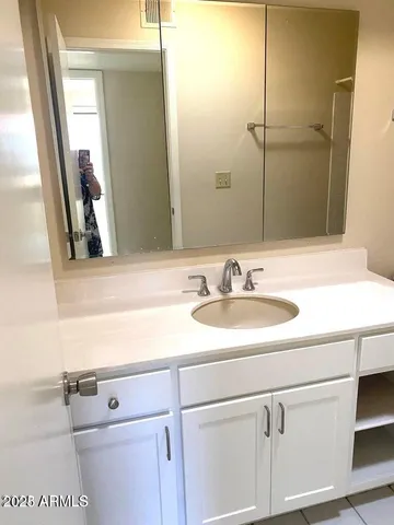 a bathroom with a toilet and shower
