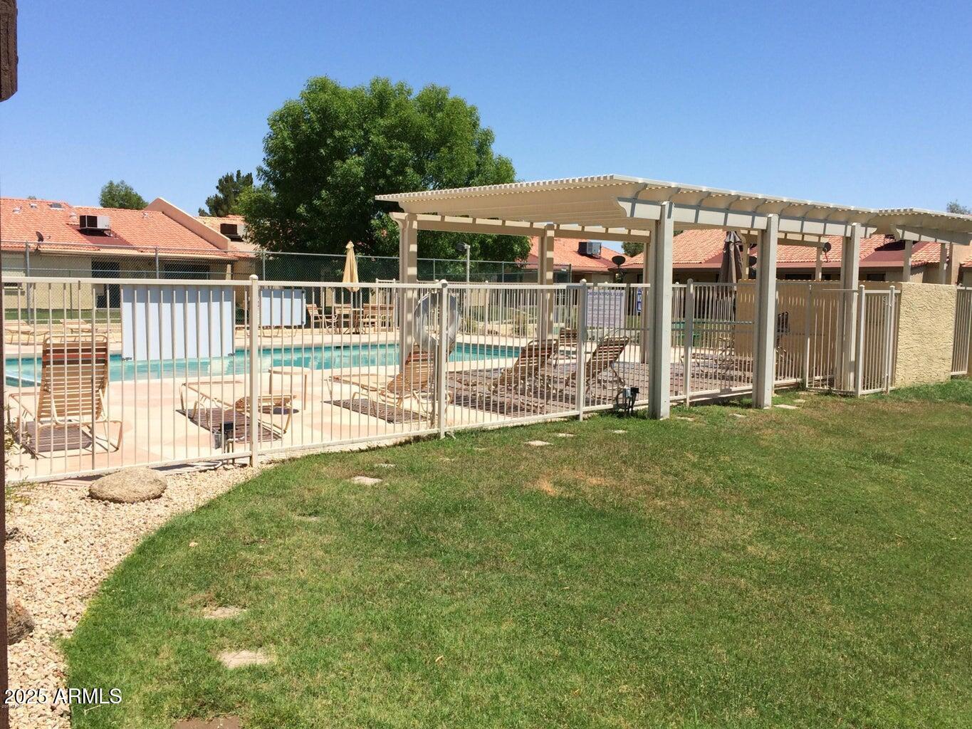 1021 South Greenfield Road, Unit 1198 Mesa, AZ 85206 - Photo 24 of 29 a view of a house with a backyard