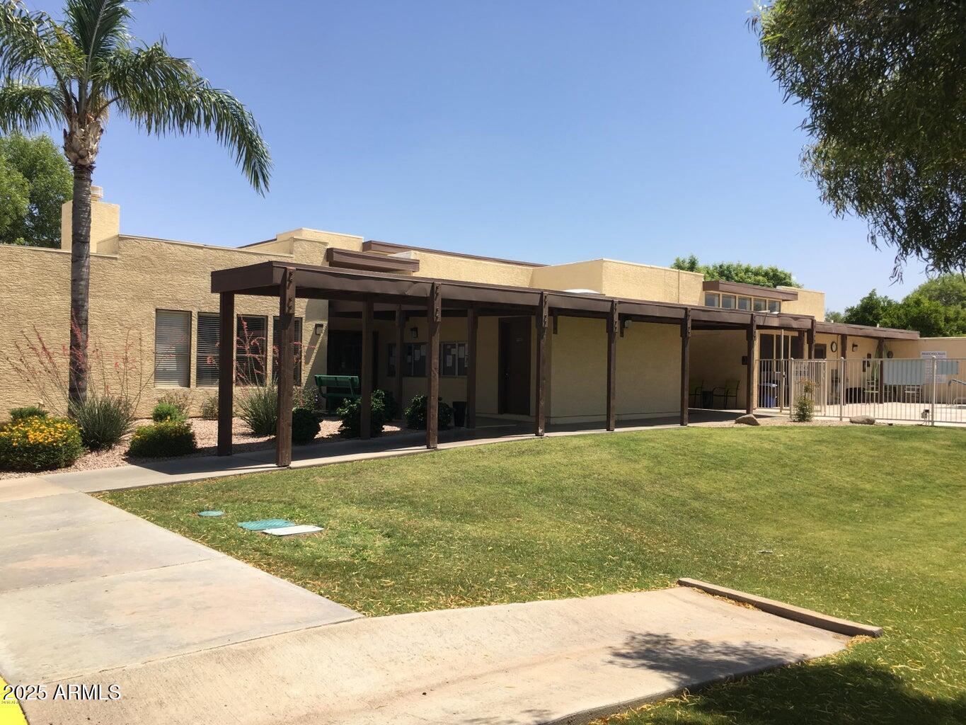 1021 South Greenfield Road, Unit 1198 Mesa, AZ 85206 - Photo 26 of 29 front view of a house with a yard