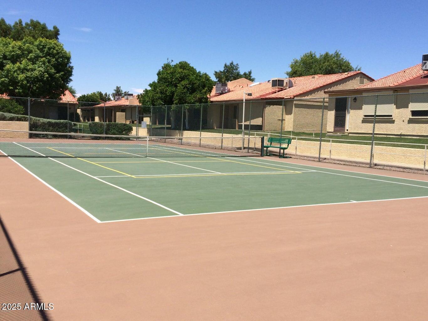 1021 South Greenfield Road, Unit 1198 Mesa, AZ 85206 - Photo 29 of 29 a view of a tennis ground with large trees