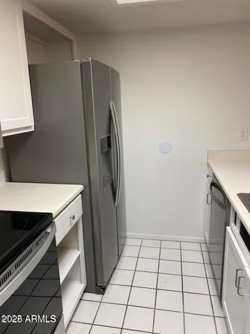 a kitchen with a refrigerator stove and microwave