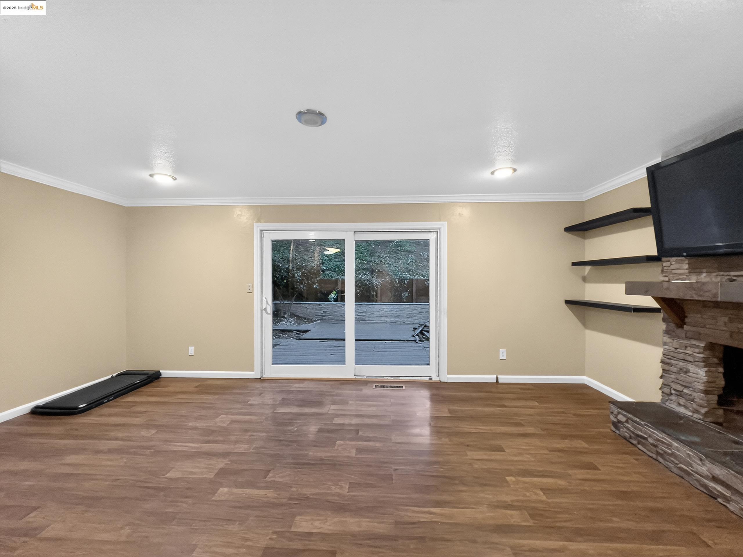 2322 Peachtree Circle Antioch, CA 94509 - Photo 13 of 43 a view of empty room with wooden floor and fan