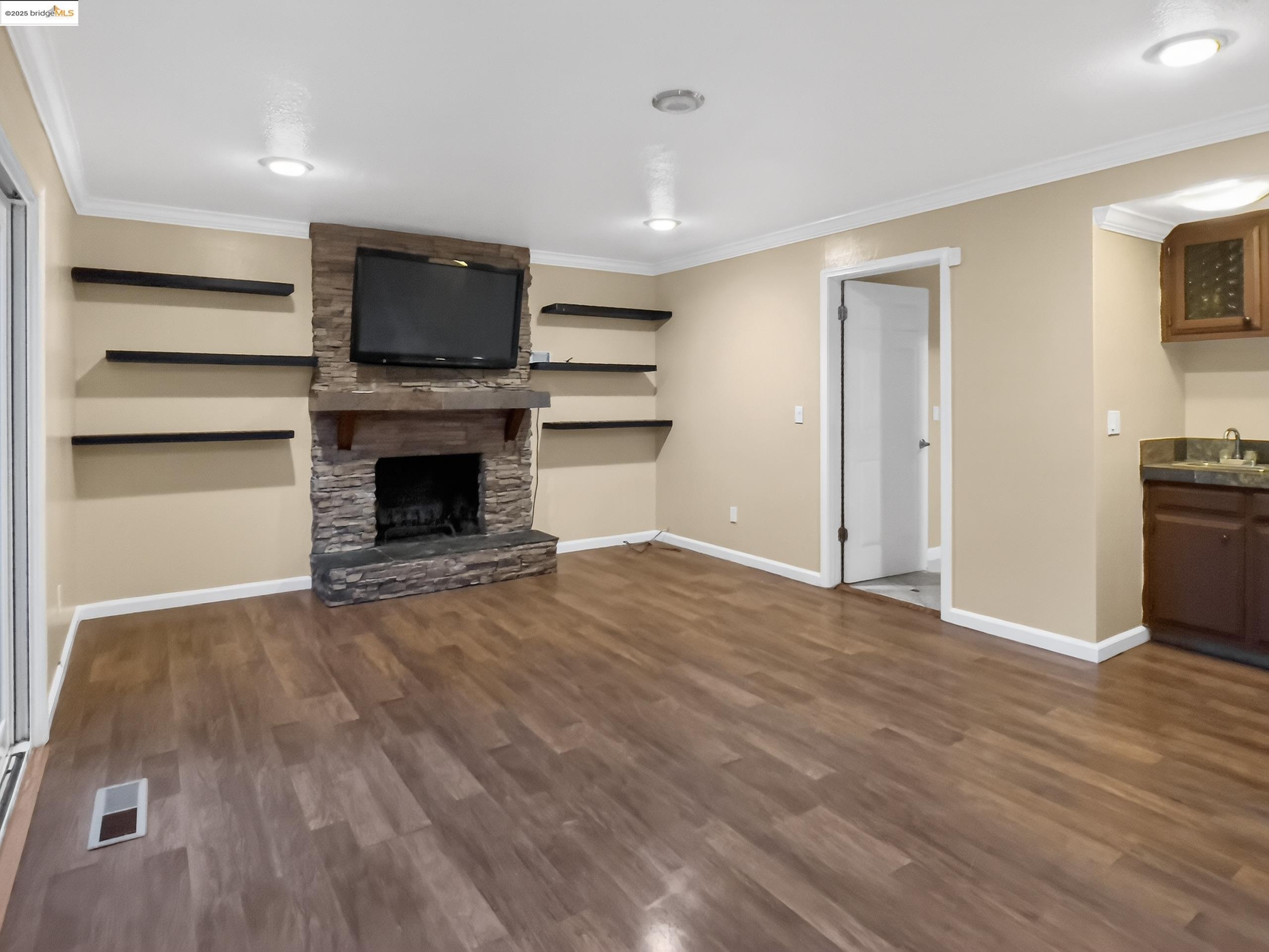 2322 Peachtree Circle Antioch, CA 94509 - Photo 16 of 43 a view of empty room with kitchen and fireplace