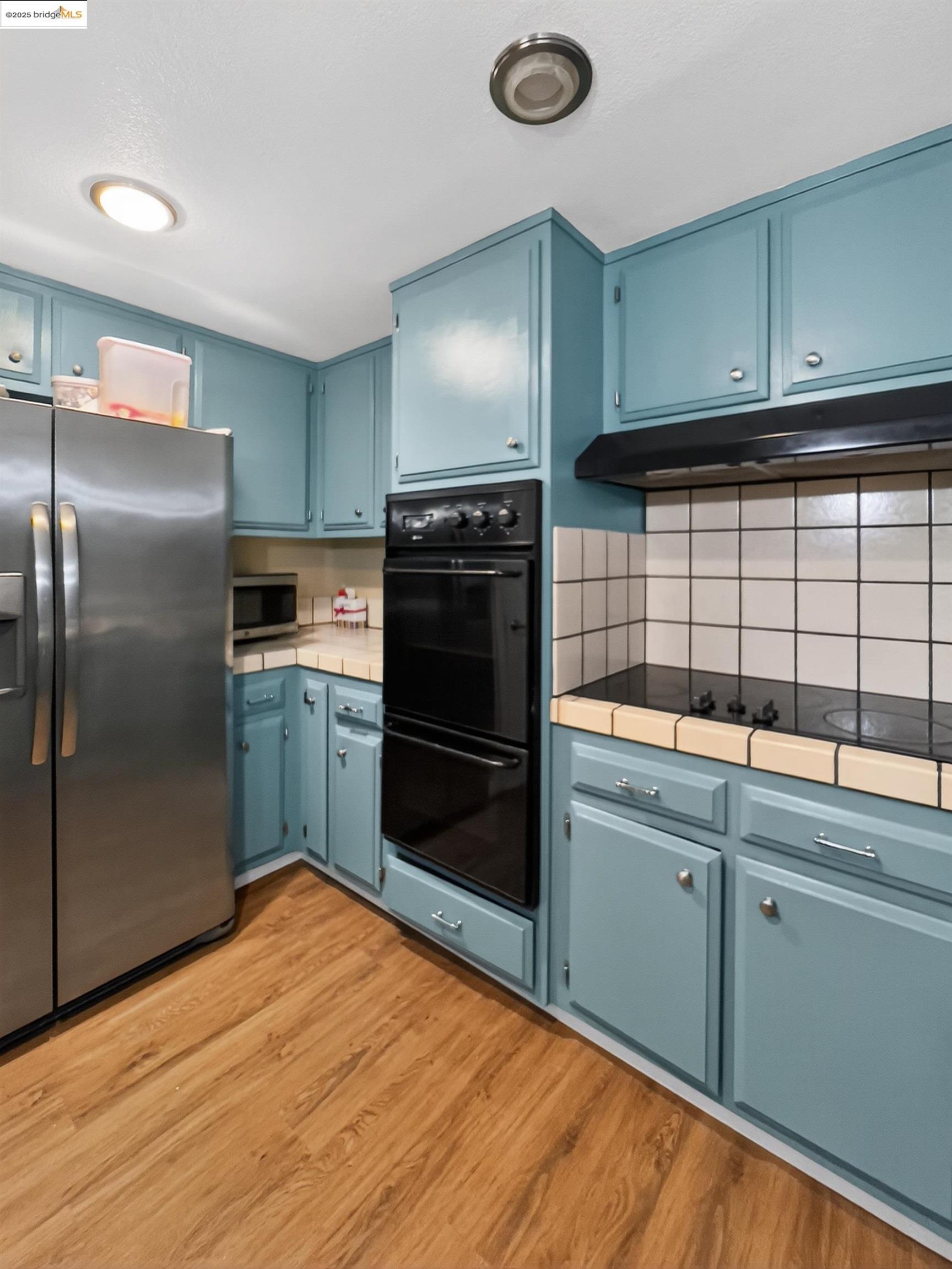 2322 Peachtree Circle Antioch, CA 94509 - Photo 21 of 43 a kitchen with stainless steel appliances granite countertop a refrigerator a sink and a stove