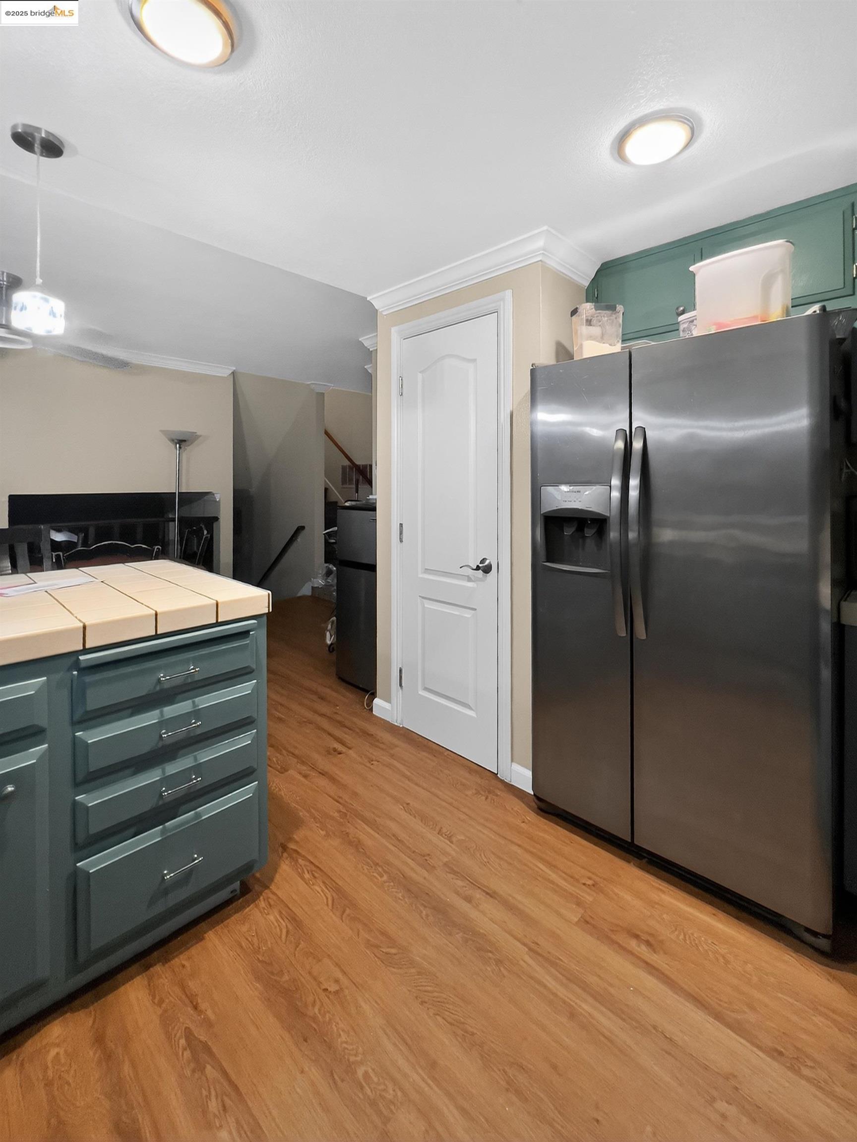 2322 Peachtree Circle Antioch, CA 94509 - Photo 22 of 43 a kitchen with stainless steel appliances kitchen island a refrigerator sink and cabinets