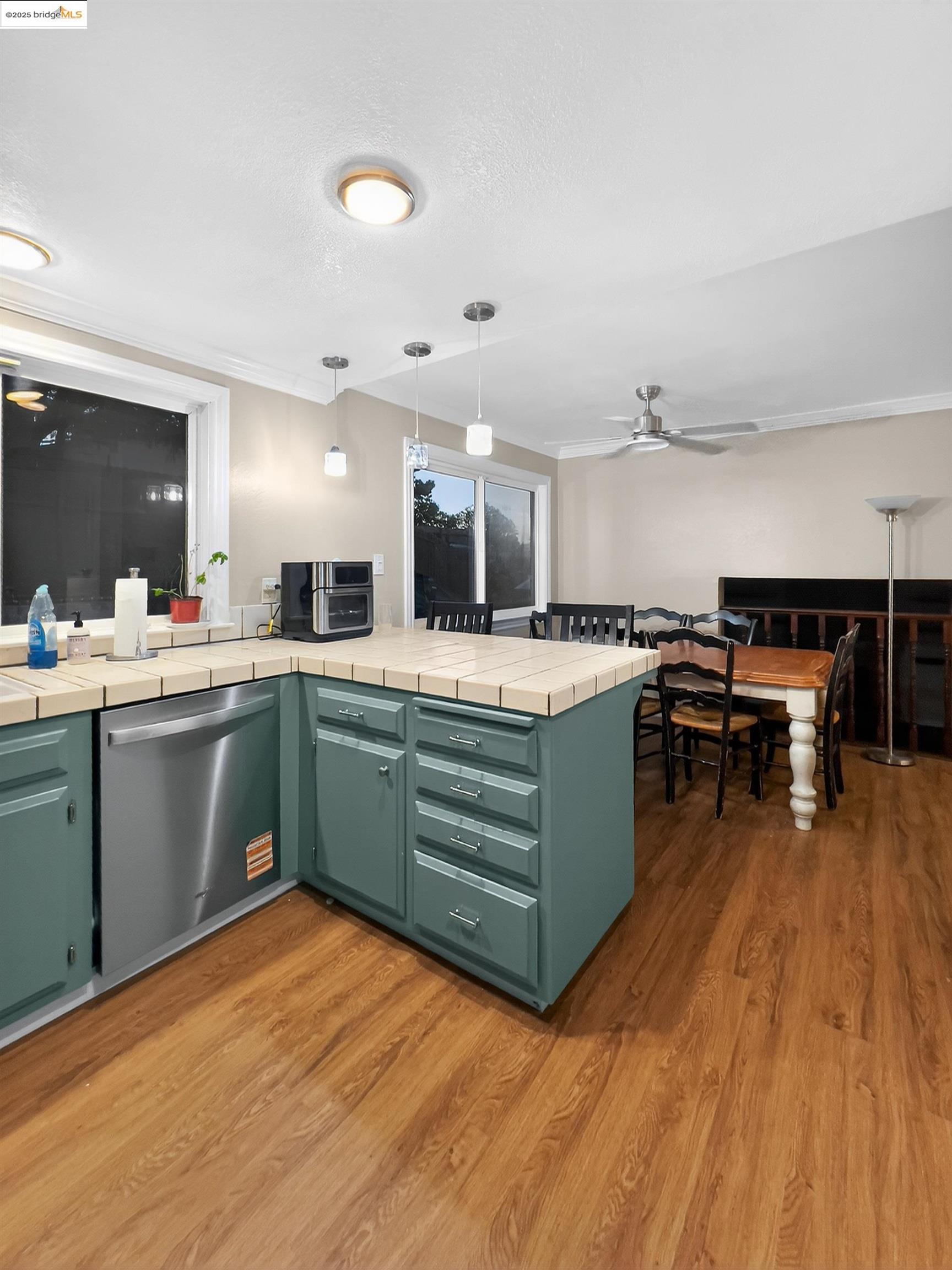 2322 Peachtree Circle Antioch, CA 94509 - Photo 23 of 43 a kitchen with a sink cabinets and wooden floor
