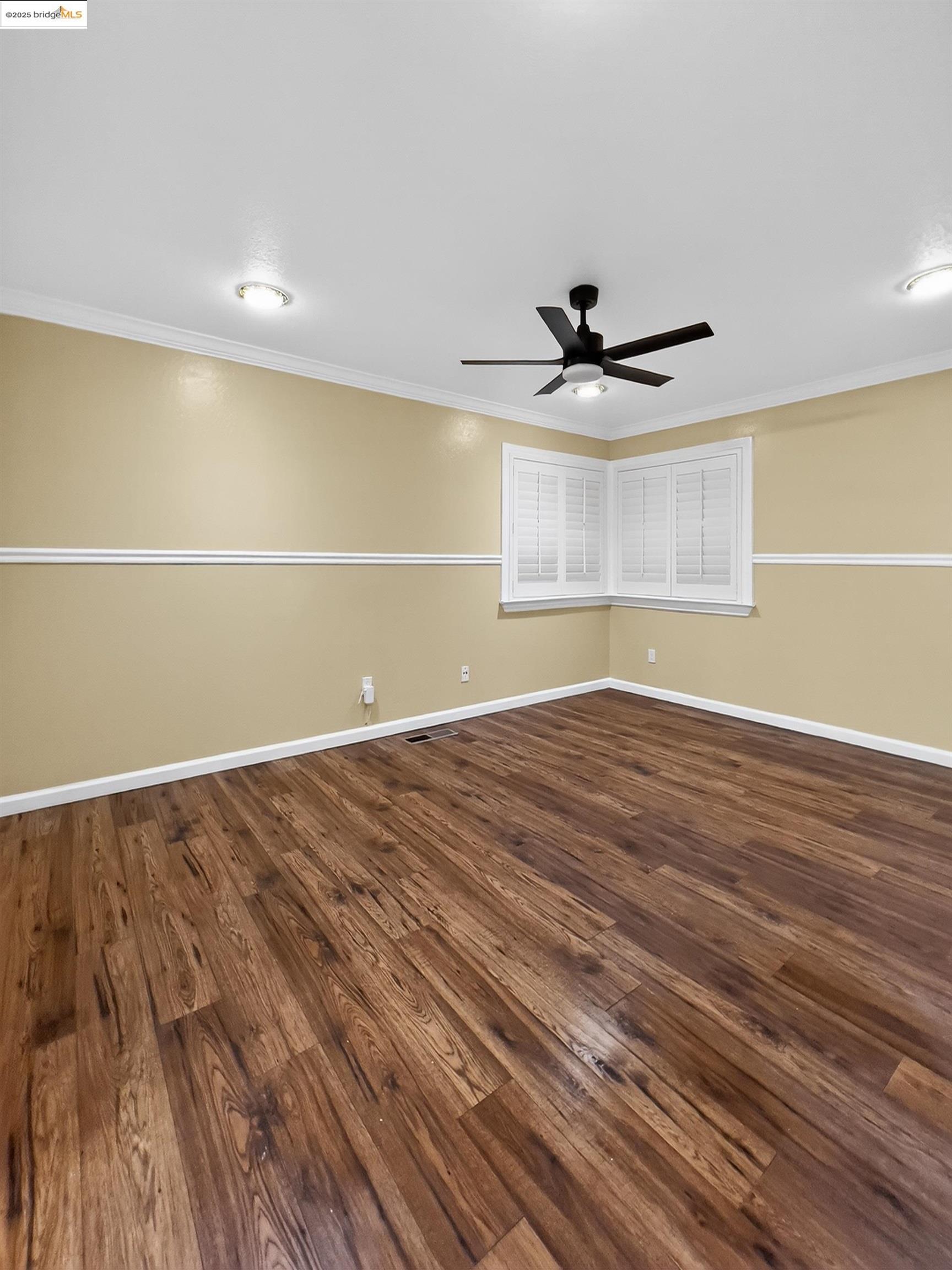 2322 Peachtree Circle Antioch, CA 94509 - Photo 5 of 43 an empty room with wooden floor and windows