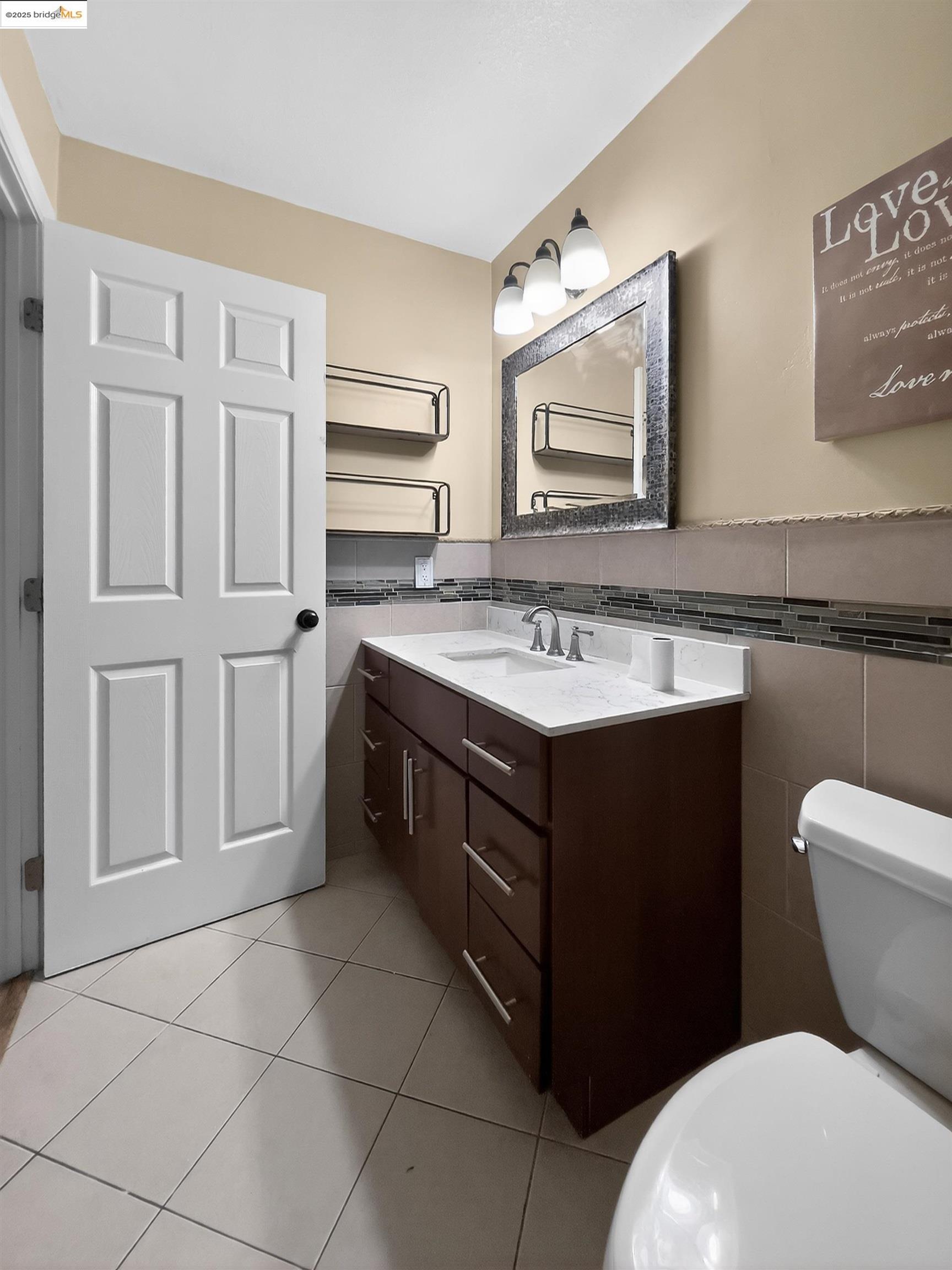 2322 Peachtree Circle Antioch, CA 94509 - Photo 8 of 43 a bathroom with a sink toilet and mirror