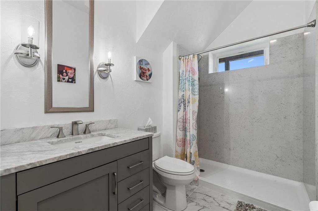 1029 Hoffman Road Smithton, PA 15479 - Photo 33 of 48 a bathroom with a granite countertop sink toilet and shower