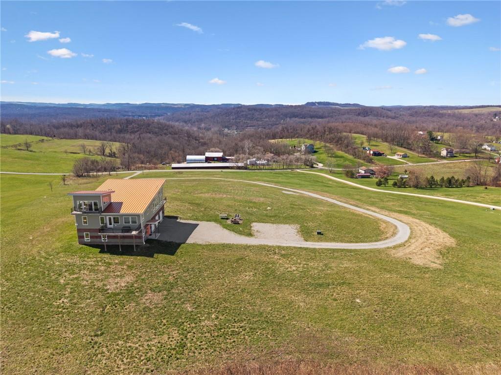 1029 Hoffman Road Smithton, PA 15479 - Photo 39 of 48 a view of a swimming pool and mountains in the background