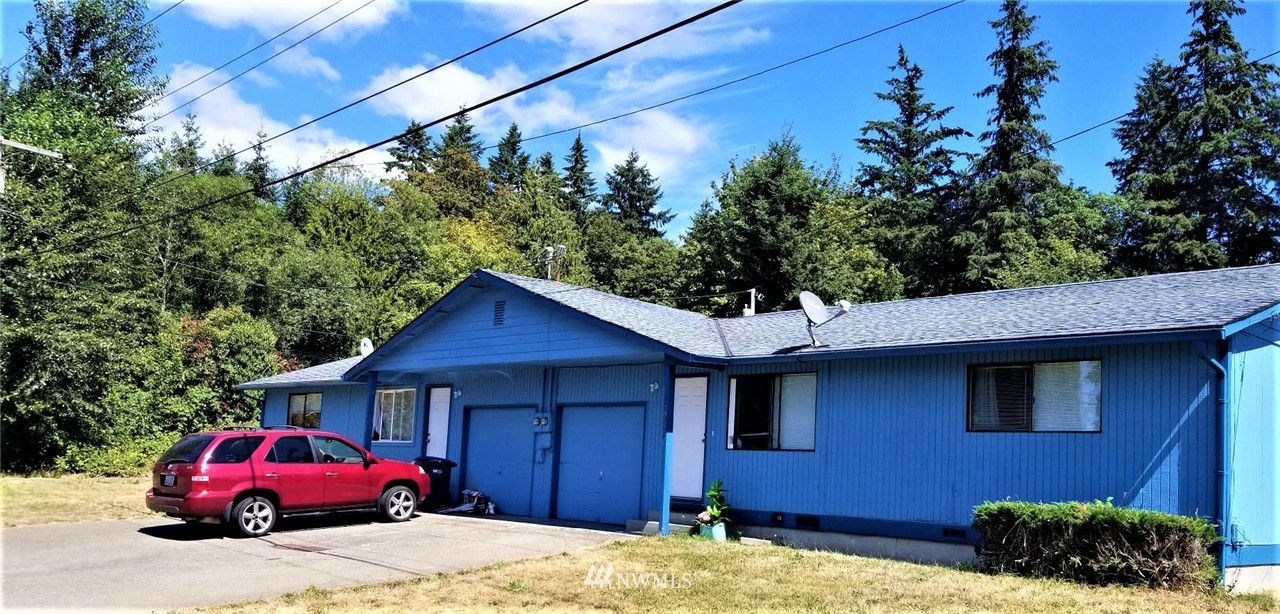 2728 Pine Road Northeast Bremerton, WA 98310 - Photo 1 of 21 a house with trees in the background