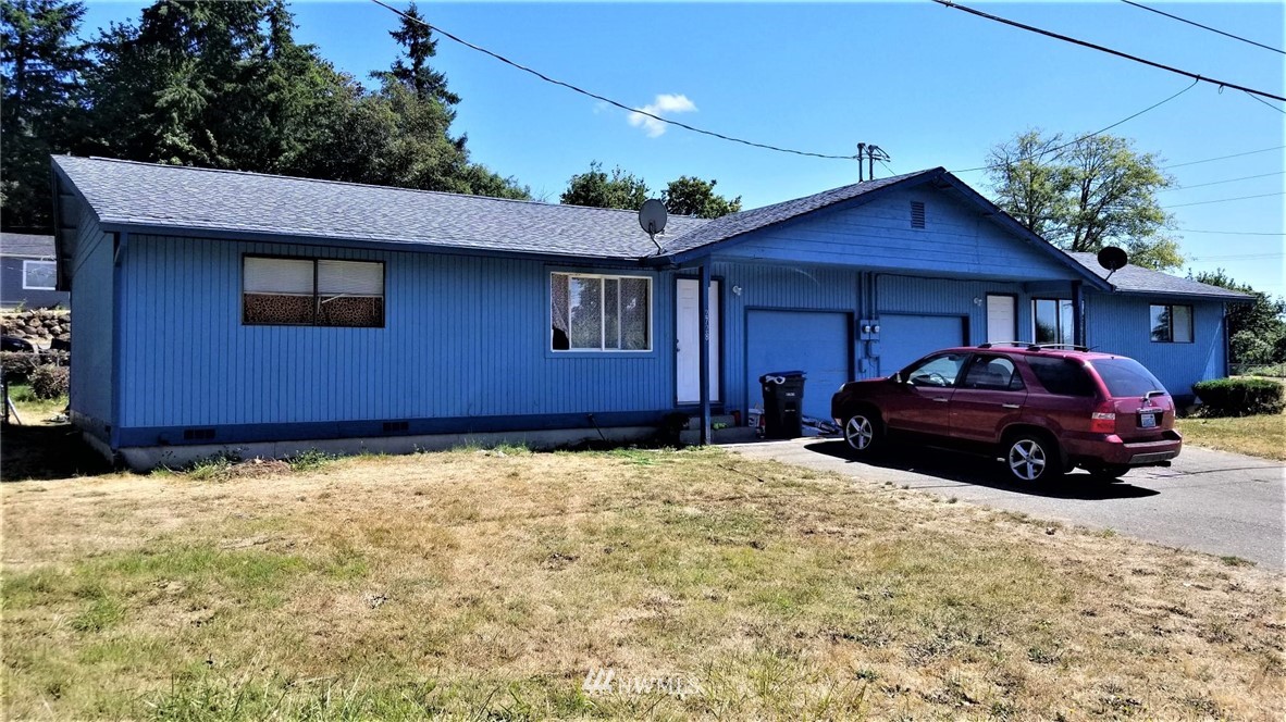 2728 Pine Road Northeast Bremerton, WA 98310 - Photo 2 of 21 a car parked in front of a house