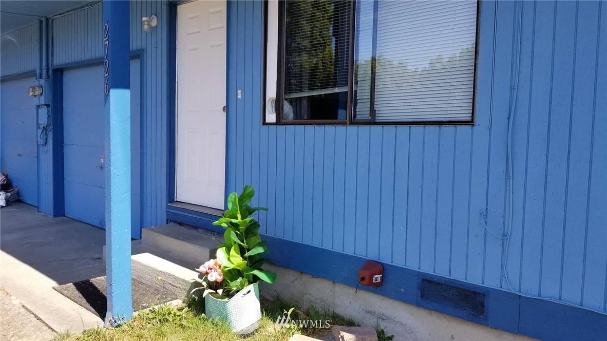 2728 Pine Road Northeast Bremerton, WA 98310 - Photo 4 of 21 a potted plant sitting in front of a door