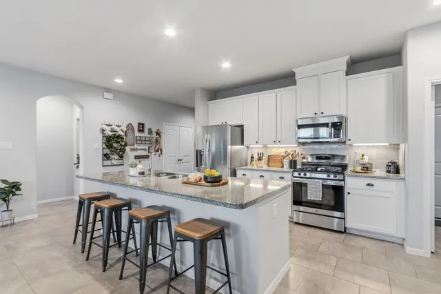 a view of a dining room with furniture and window