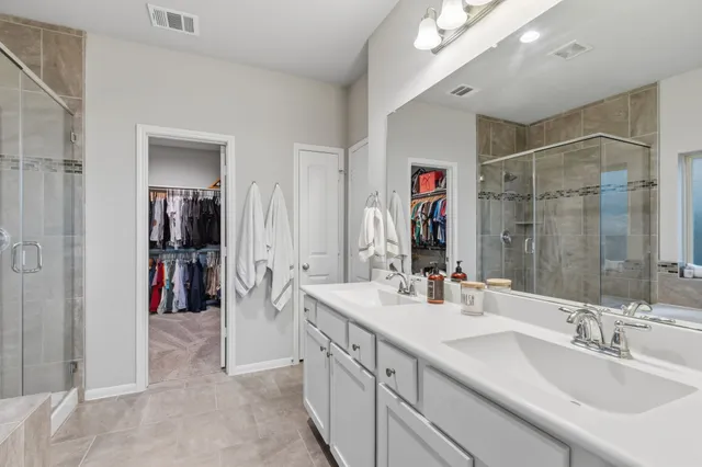 a spacious bathroom with a bathtub and a shower
