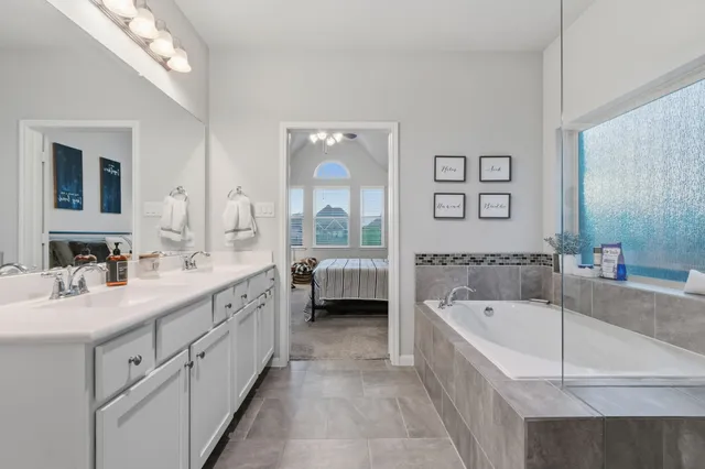 a bedroom with a bed and cabinets