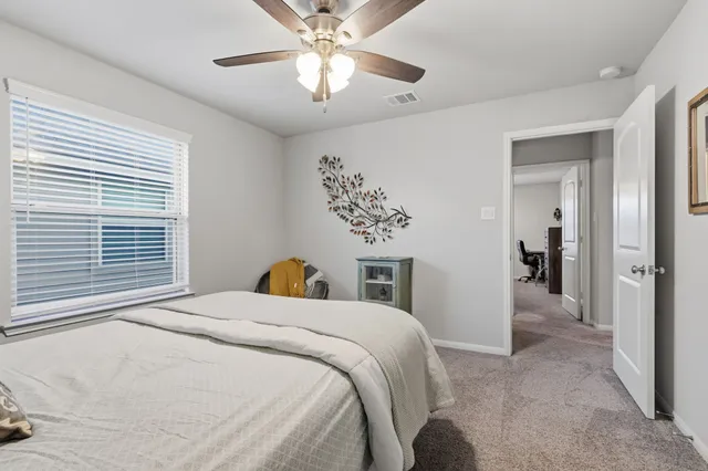 a view of a garden with a building in the background