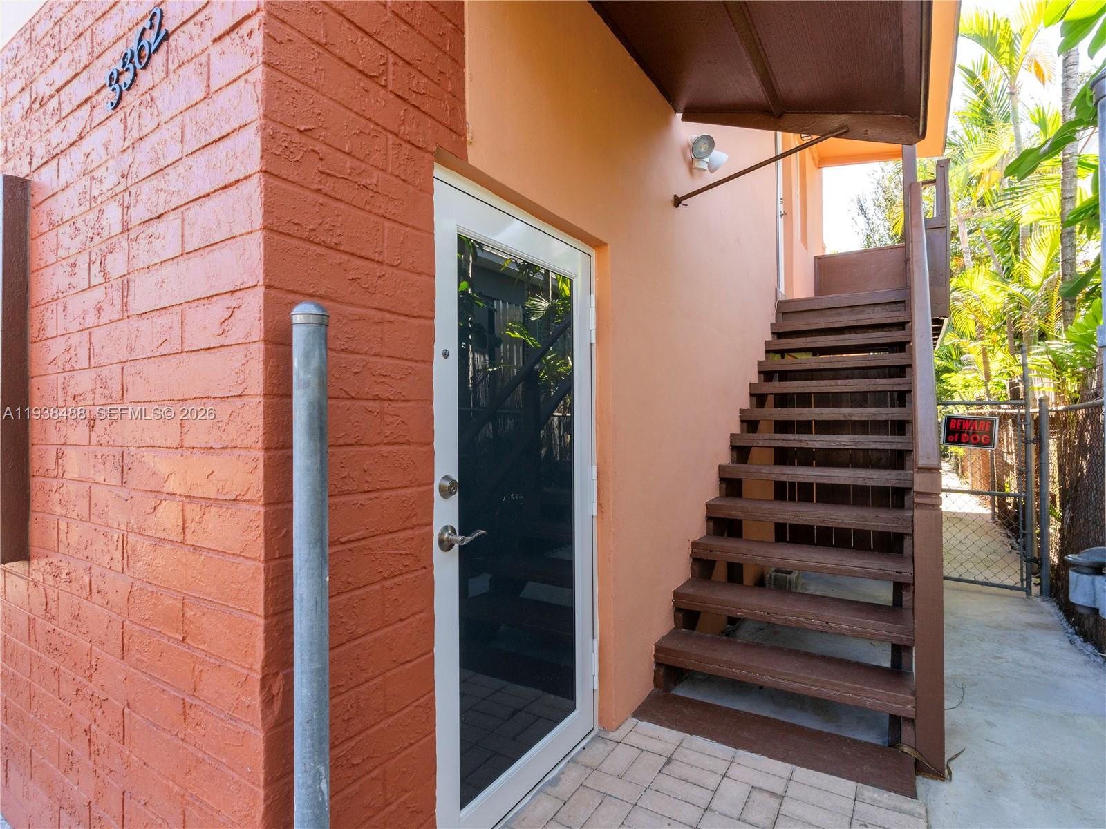 3360 Southwest 6th Street, Unit BOTTOM Miami, FL 33135 - Photo 4 of 17 a view of entryway with wooden door and wooden floor