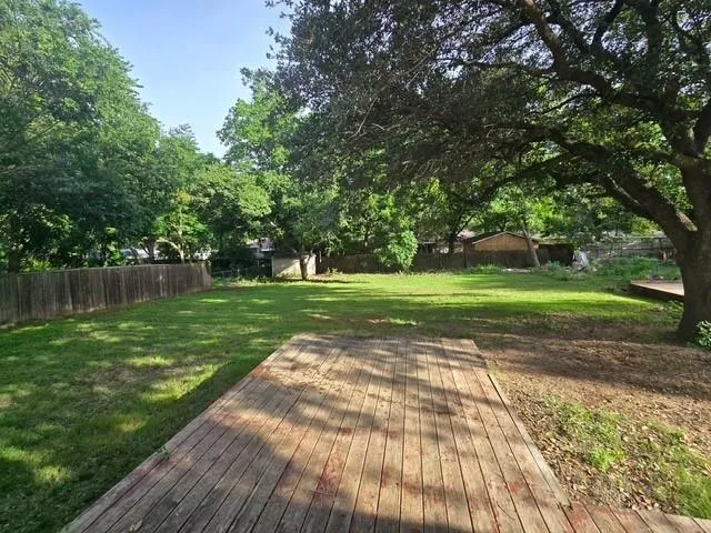 a view of a park with large trees