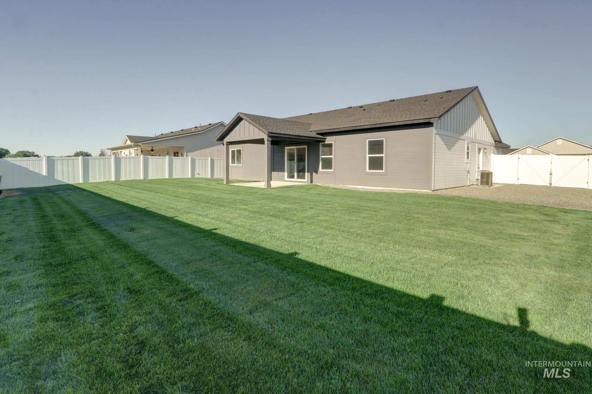 848 North 5th Street Nyssa, OR 97913 - Photo 48 of 49 Expansive rear yard featuring a manicured lawn and complete vinyl perimeter fencing