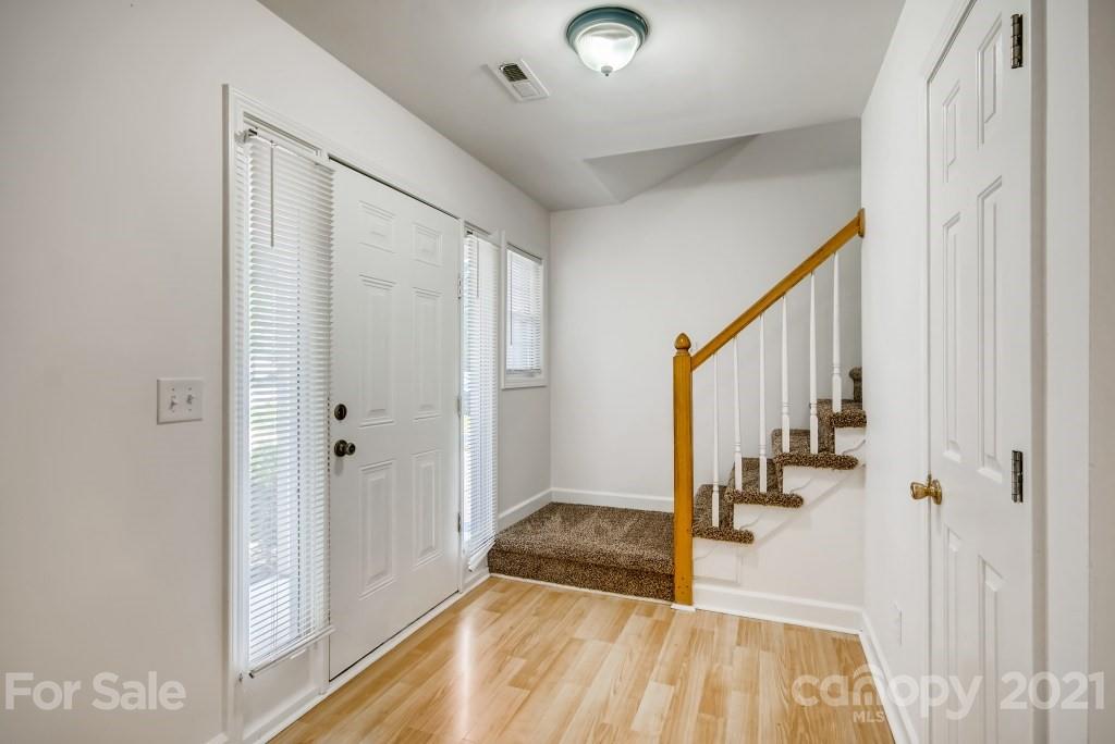 1512 Mineral Springs Road Charlotte, NC 28262 - Photo 2 of 19 a view of a hallway with wooden floor and staircase