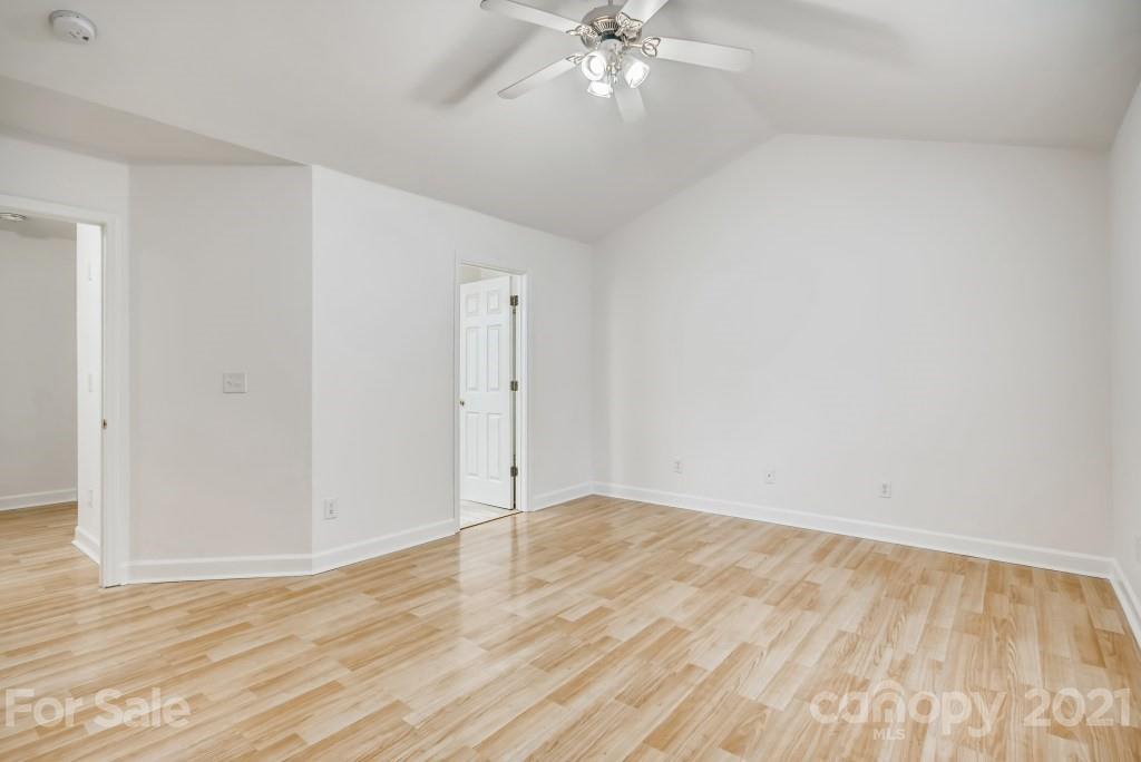 1512 Mineral Springs Road Charlotte, NC 28262 - Photo 11 of 19 a view of an empty room with wooden floor