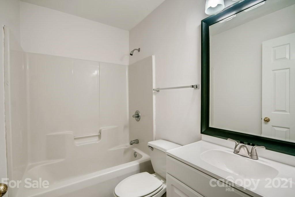 1512 Mineral Springs Road Charlotte, NC 28262 - Photo 16 of 19 a bathroom with a sink toilet and shower